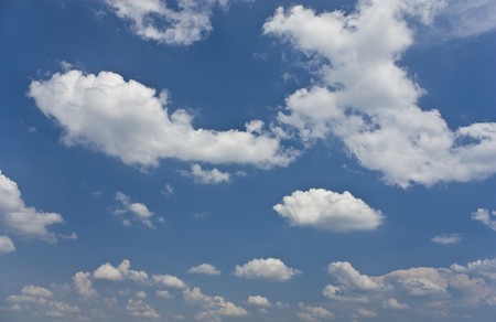 sunny day with many clouds on the skyの写真素材