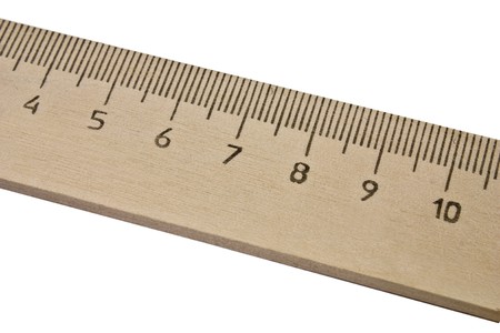 old wooden ruler isolated on the white backgroundの写真素材