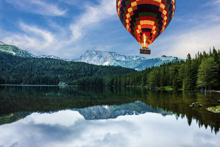 Montenegro, Durmitor national park. Hot air balloon, mountain lake landscapeの写真素材