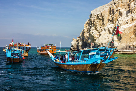 Khasab, Oman - May 27, 2022: Tourist dhow boats, Musandam peninsula fjords.