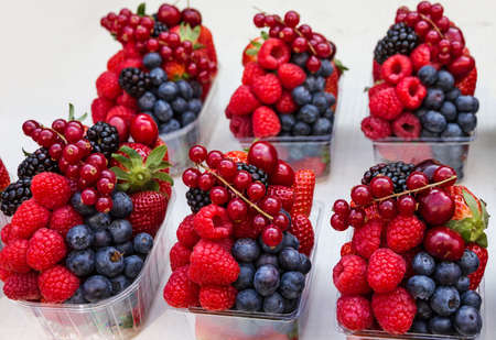 berries on the market - red currant, raspberry and blackberry,の写真素材