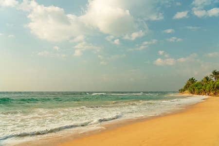 Sea sand beach resort landscape, ocean waves, Sri Lankaの写真素材