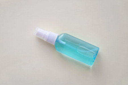 Hand sanitizer blue bottle on white background, anti-infective hygienic antibacterial agent concept