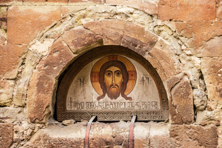 Tbilisi, Georgia - May 12, 2022: Icon of Christ on the building of ancient Georgian church.のeditorial素材