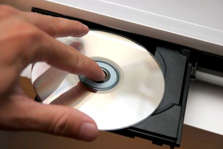 insert CD on CD playerの写真素材