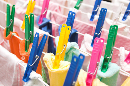details of colorful clothespins, drying