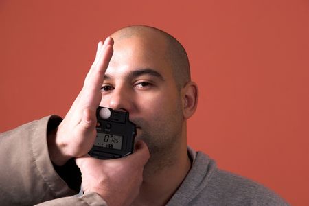 holding a flashmeter, test on modelの写真素材