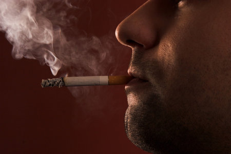 close up of an smoking man