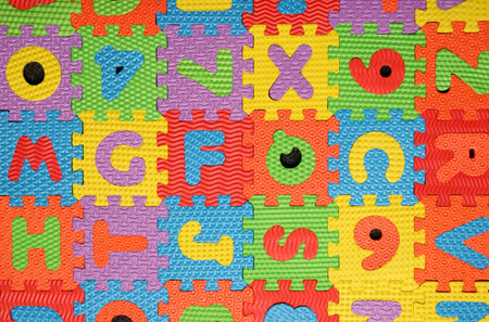 multi colored alphabet puzzle backgroundの写真素材