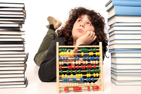 boy with abacus calculator with colored beads and booksの写真素材