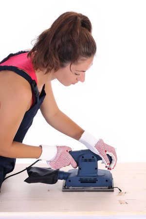 woman carpenter at work on white background の写真素材