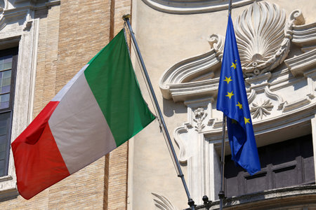 Flags of Italy and European Union waving in Rome, Italy