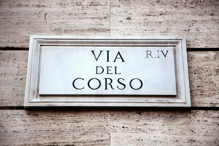 Via del Corso sign on building wall in Rome, Italyの写真素材