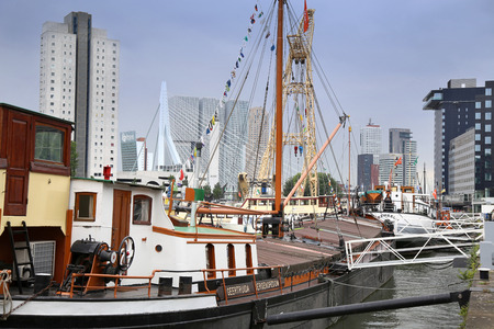 ROTTERDAM, THE NETHERLANDS - 18 AUGUST: Old cranes in Historical Leuvehaven, Rotterdam's oldest sea port. Harbor and modern apartment buildings in Rotterdam, Netherlands on August 18,2015.のeditorial素材