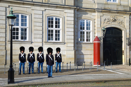 COPENHAGEN, DENMARK - AUGUST 15, 2016: Danish Royal Life Guards on the central plaza of Amalienborg palace, home of the Danish Royal family in Copenhagen, Denmark on August 15, 2016.のeditorial素材