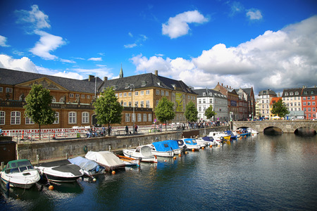 COPENHAGEN, DENMARK - AUGUST 14, 2016: View of canal, boat with tourist and old bridge from bridge Marmorbroen in Copenhagen, Denmark on August 14, 2016.のeditorial素材
