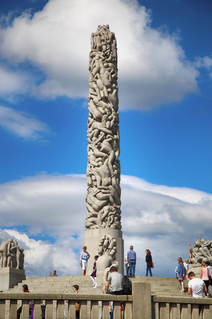 EDITORIAL OSLO, NORWAY - AUGUST 18, 2016: Many tourist walk Vigeland Sculptures Park in the popular Vigeland park ( Frogner Park ), designed by Gustav Vigeland in Oslo, Norway on August 18, 2016.のeditorial素材