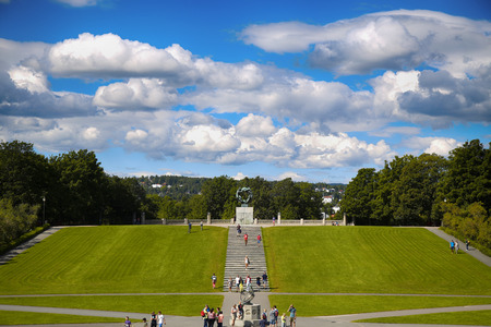 EDITORIAL OSLO, NORWAY - AUGUST 18, 2016: Many tourist walk Vigeland Sculptures Park in the popular Vigeland park ( Frogner Park ), designed by Gustav Vigeland in Oslo, Norway on August 18, 2016.のeditorial素材