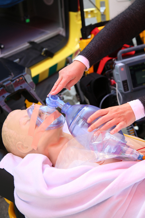 Details of practicing to use an oxygen mask on training dollの写真素材