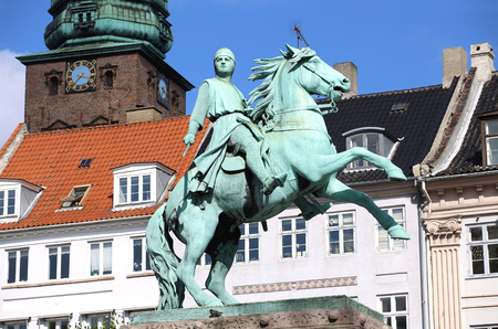 Hojbro Plads Square with the equestrian statue of Bishop Absalon and St Kunsthallen Nikolaj church in Copenhagen, Denmarkのeditorial素材