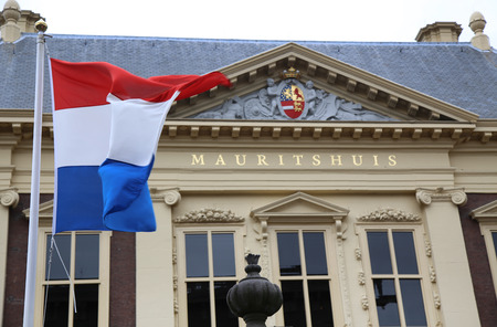 THE HAGUE, THE NETHERLANDS - AUGUST 18, 2015: The Mauritshuis art museum with flag of The Netherlands in The Hague, Netherlands on August 18, 2015.のeditorial素材