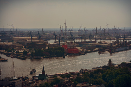 Hamburg, Germany - July 28, 2014: View of port of Hamburg harbor on the river Elbe, large container ships at the Container Terminal. The port of Hamburg is largest seaport in Germanyのeditorial素材