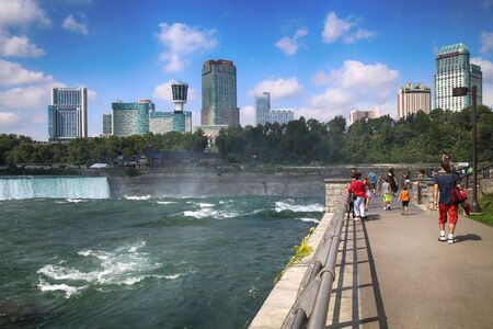 Niagara Falls, USA â August 29, 2018: Tourists view the Niagara Falls the Canadian side with famous hotels across from the American side, New York State, USAのeditorial素材