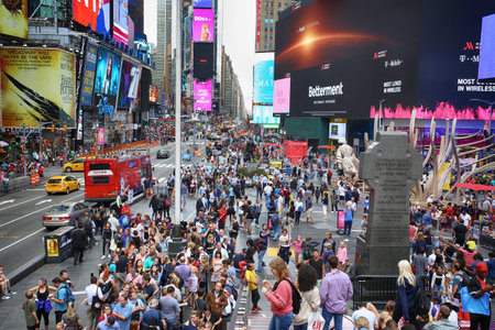 New York, USA â€“ August 24, 2018: Crowded with many people walking Times Square with huge...