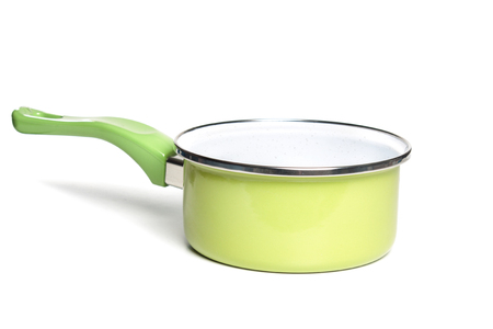 Green pot an frying pan on a seamless white background.の写真素材