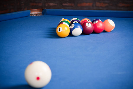 Billiard balls / A Vintage style photo from a billiard balls in a pool table. Noise added for a film effectの写真素材