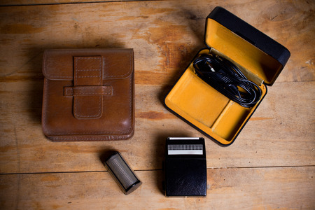 old electric razor on a wooden table.の写真素材