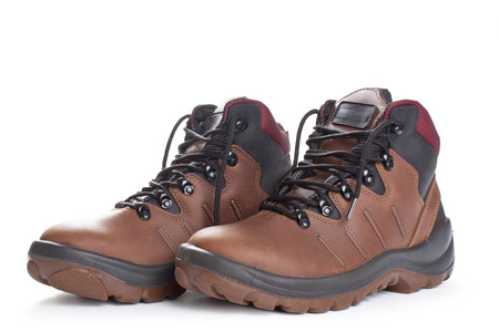 Pair of brown  working boots Isolated on white backgroundの写真素材