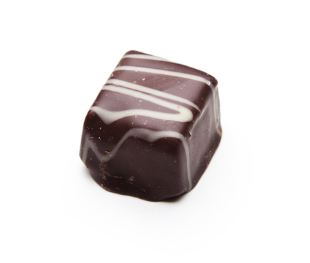 Chocolate piece isolated on a white backgroundの写真素材