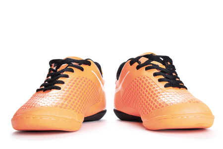 Pair of orange  sport shoes on white background.の写真素材