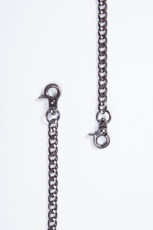 Black metal chain on white background.