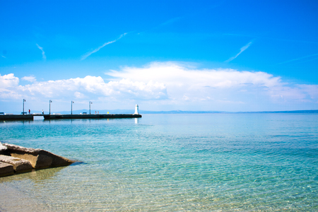 Pier at sunny day in Pefkohori, Greece sea backgroundの写真素材