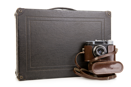 Suitcases with camera on white bcakground,Holiday Concept isolatedの写真素材