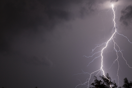 lightnings and thunder bold stike at summer storm,Huge fork lightnings and thunder during heavy summer storm.の写真素材