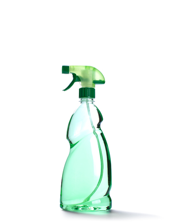 Spray bottle with green liquid isolated on whiteの写真素材
