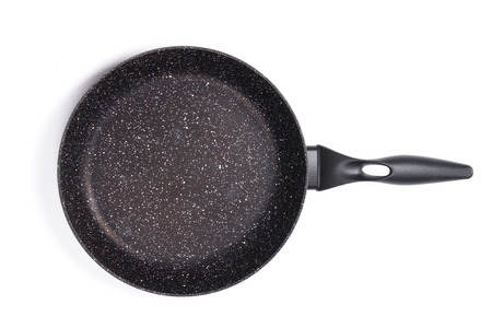 Top view of new empty frying pan isolated on white...の写真素材