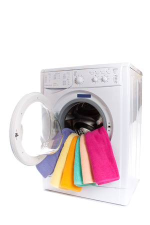 Washing machine with laundry isolated on white backgroundの写真素材