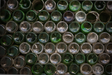 Bottom of the bottle texture. Glass,Dirty empty wine bottles close-up,Bottom of green bottle pattern background.の写真素材