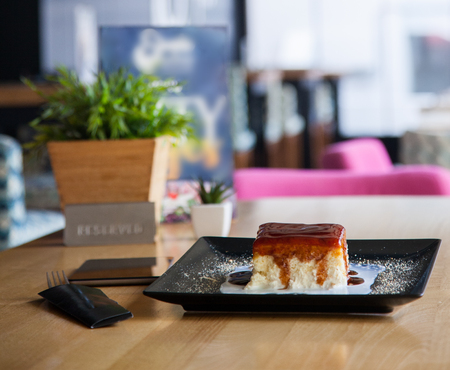 Desert time. Sweetcake served on a beautiful plate and ready for eating.の写真素材