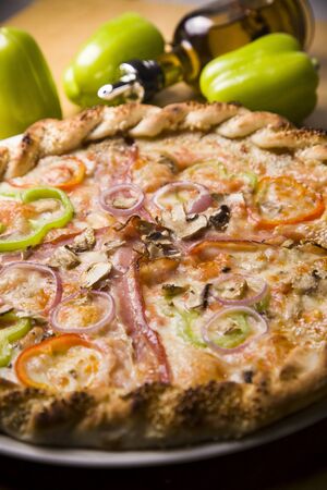 Delicious bright pizza on a dark wooden background,Italian pizza.の写真素材