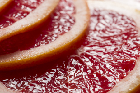 Close up of a multiple juicy grapefruit cross sections. Selective focusの写真素材