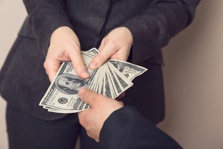 Corrupted business woman offering money for bribe