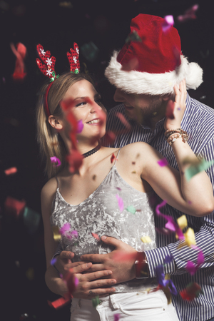Young couple in love dancing at New Year's Eve party and having funの写真素材