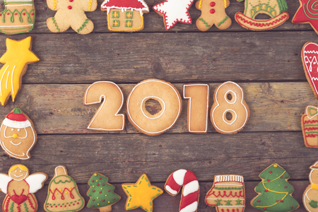 Table top shot of a frame made of nicely decorated Christmas cookies with numbers 2018 in itの写真素材