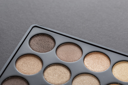 High angle view of an eyeshadow palette isolated on black backgroundの写真素材