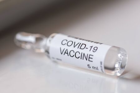 Coronavirus vaccine vial; treatment for covid-19 infection; novel coronavirus treatment and vaccination research conceptの写真素材